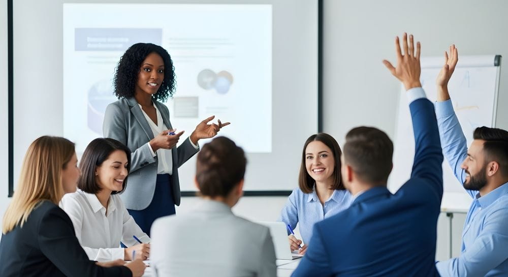 Black woman leads meeting in professional setting.