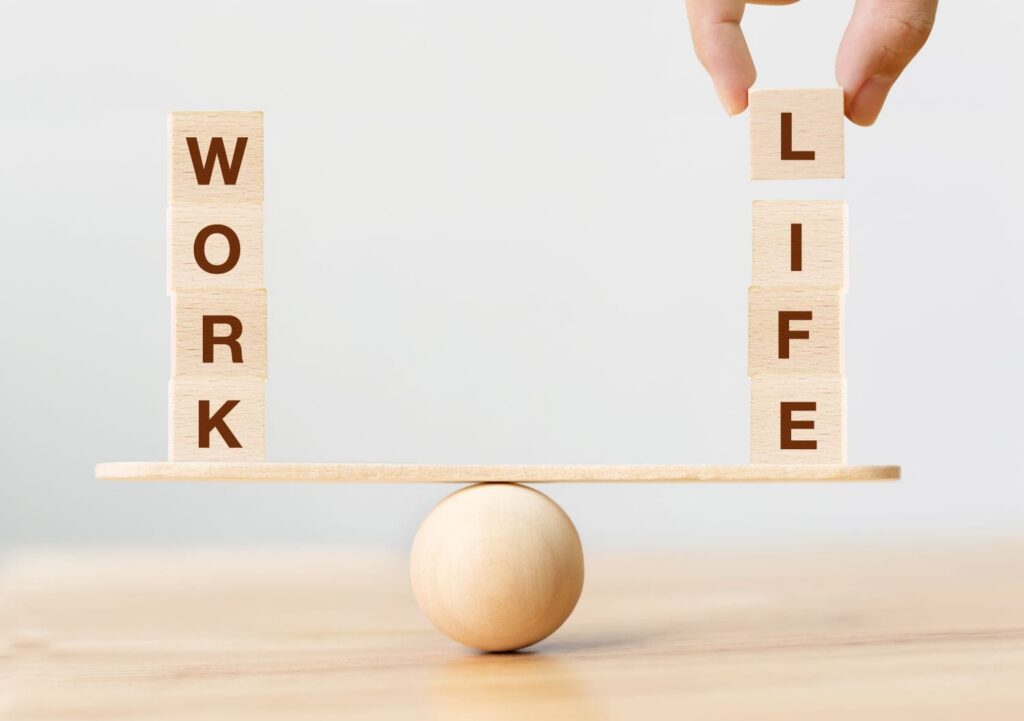 Scale with work on one side and life on the other.